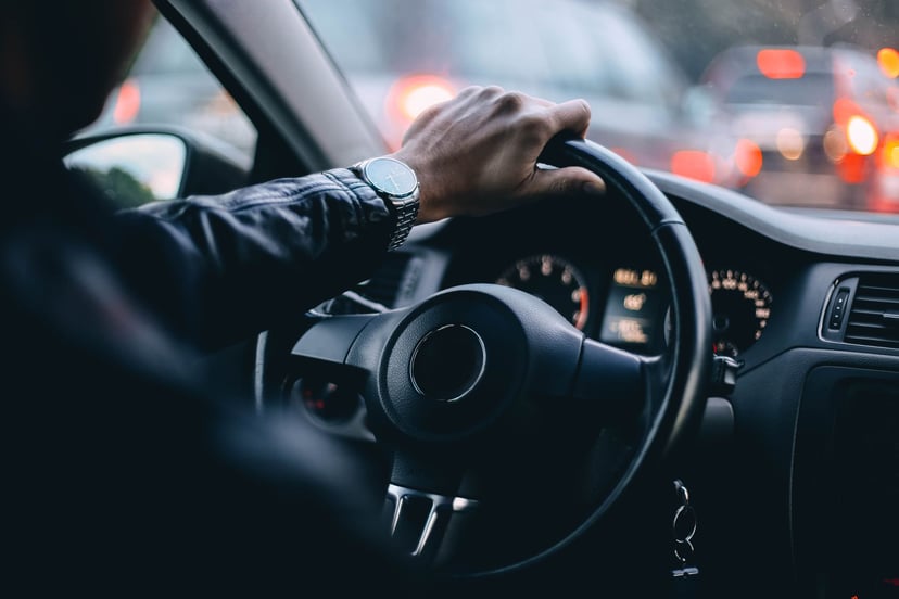 Man In Suit Driving